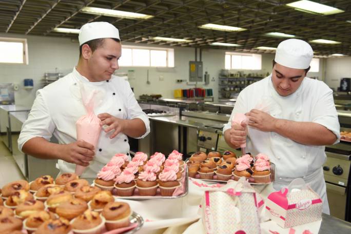 ITS students prepare Pink October cupcakes with proceeds going towards the Marigold Foundation for Breast Cancer Awareness Month